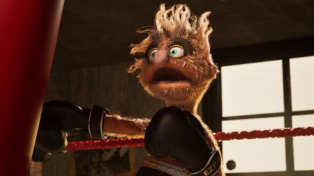 Felt That: Boxing screenshot of puppet boxer Ezra "Fuzz-E" Wright, who swings at a punching bag