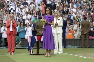 Kate Middleton wearing a purple dress and presenting a trophy at the Wimbledon 2024 men's finals