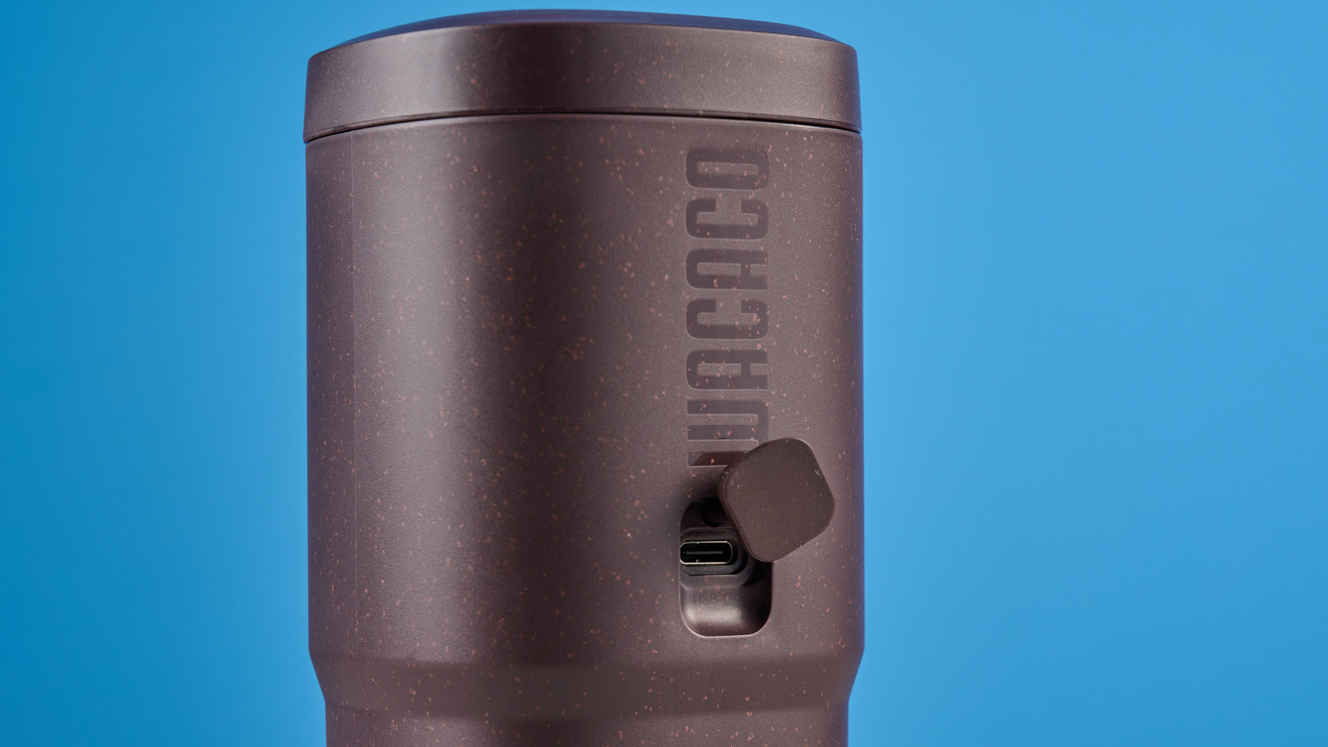 the wacaco pixapresso portable self-heating espresso maker in dark purple color showing usability with nespresso pods and ground coffee, ideal for vacations and camping