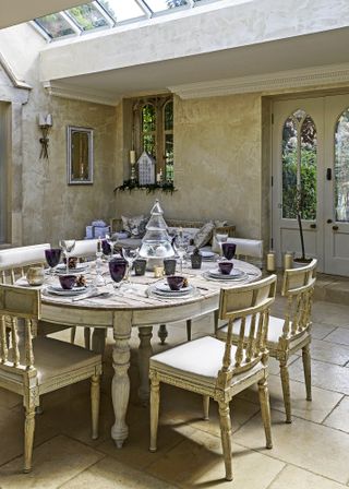 gustavian-style dining chairs and table set for dinner