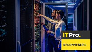 man and woman working in data centre in server racks