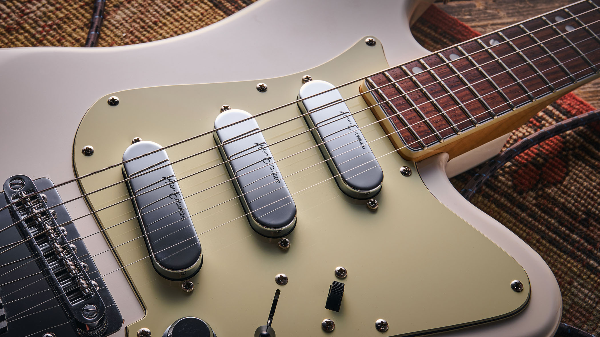 Vintage REVO Astrostar: the retro-inspired electric has three single-coils, a white finish with cream pickguard and is photographed in close-up.