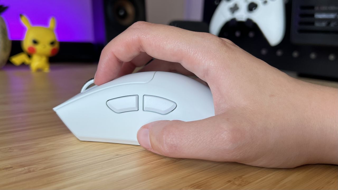 Hand using Razer DeathAdder V4 Pro gaming mouse in a claw grip