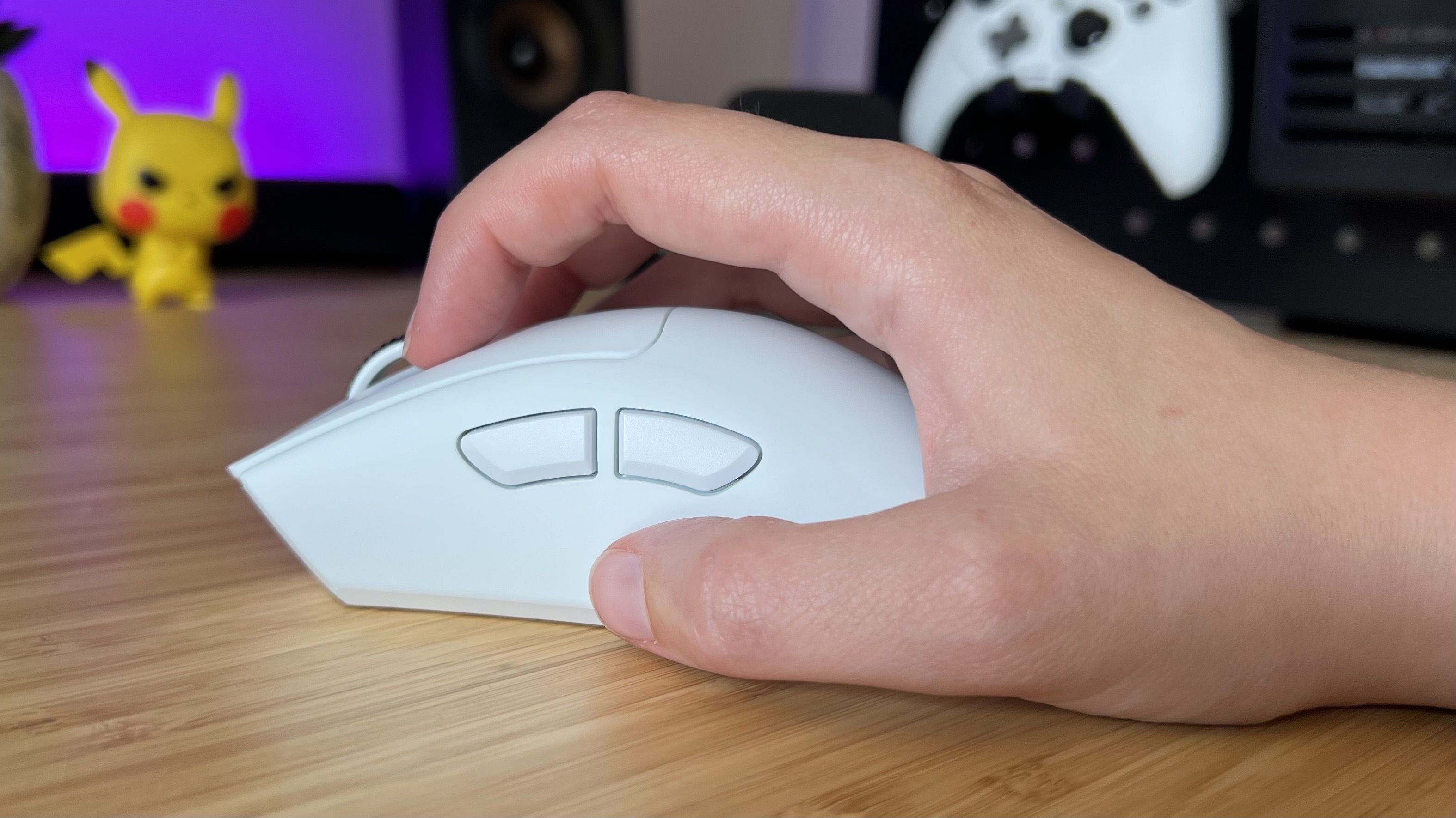 Hand using Razer DeathAdder V4 Pro gaming mouse in a claw grip