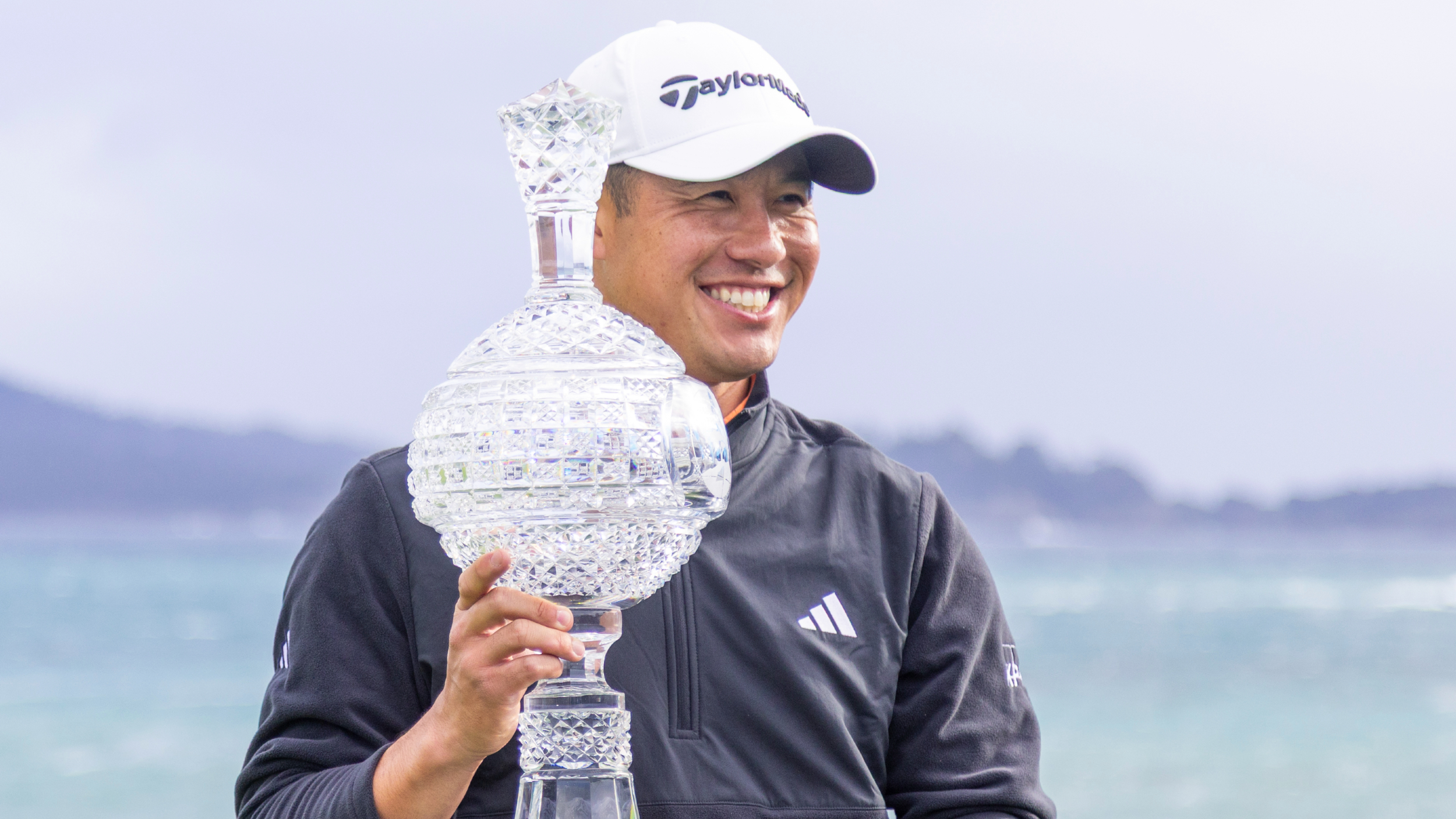 Collin Morikawa with the AT&amp;amp;T Pebble Beach Pro-Am trophy