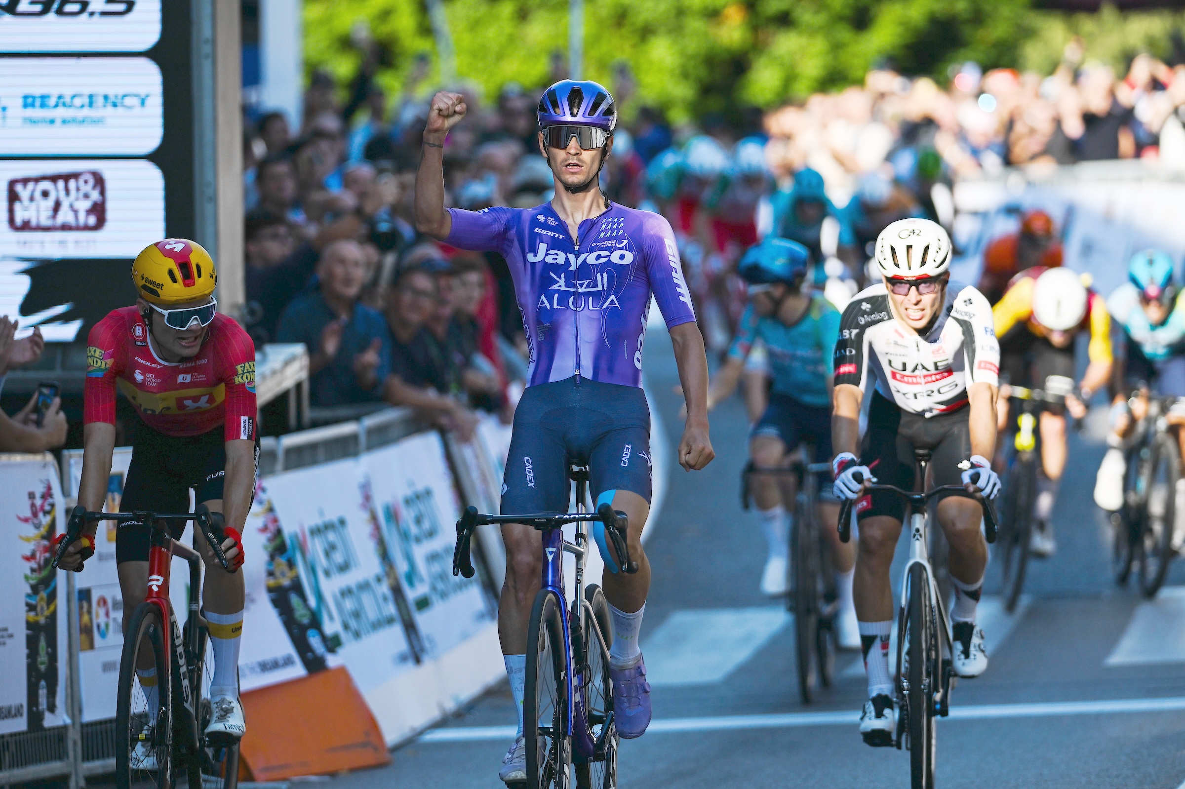 VINCENZA, ITALY - OCTOBER 14: Alessandro Covi of Italy and Team Jayco AlUla celebrates at finish line as race winner ahead of (L-R) Anthon Charmig of Denmark and Team Uno-X Mobility and Benoit Cosnefroy of France and Team UAE Team Emirates - XRG during the 89th Giro del Veneto 2026 a 167km one day race from Verona to Vicenza on October 14, 2026 in Vicenza, Italy. (Photo by Tim de Waele/Getty Images)