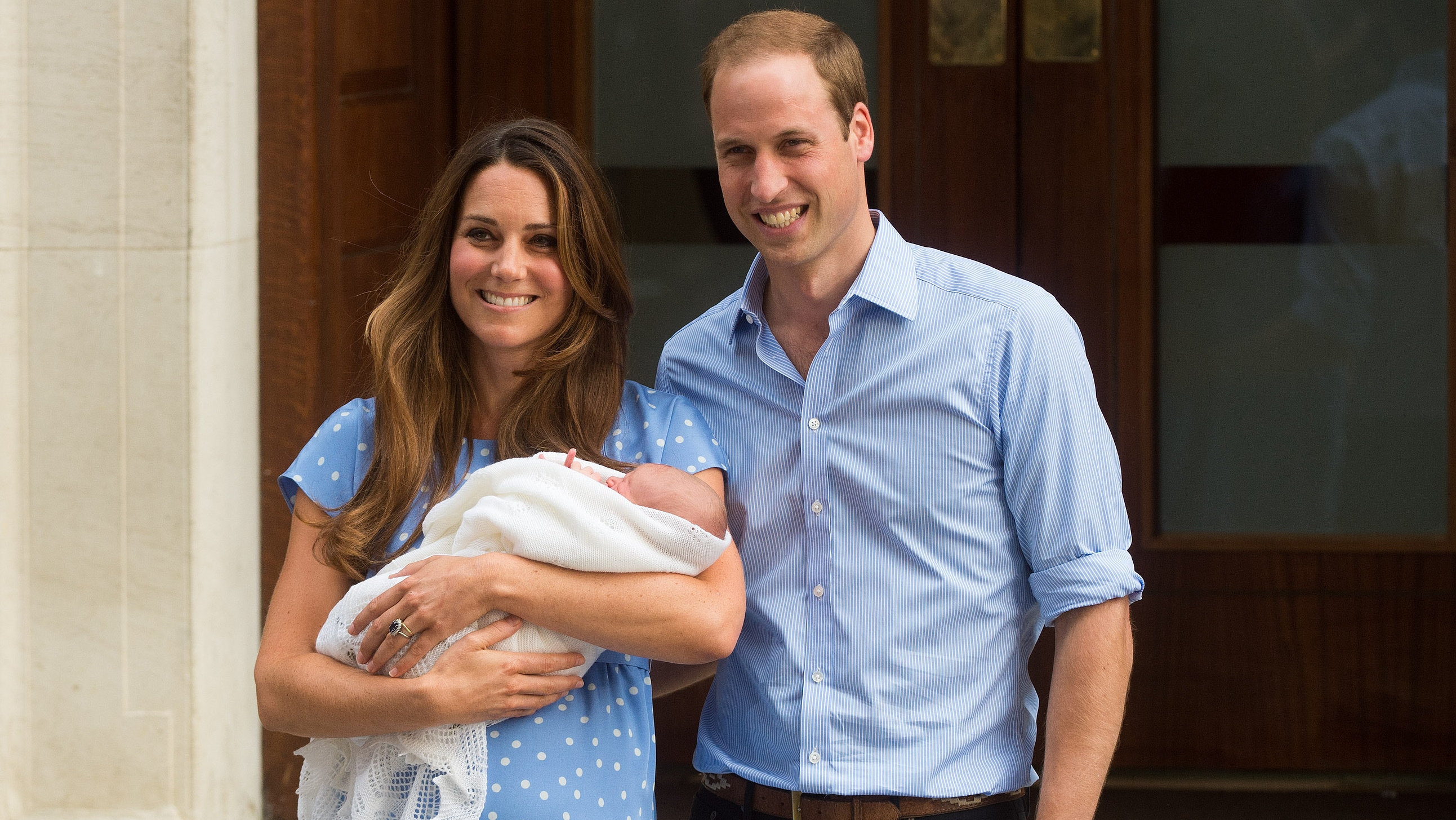 Catherine, Princess of Wales and Prince William stand outside The Lindo Wing of St Mary's Hospital with their newborn son Prince George on July 23, 2013