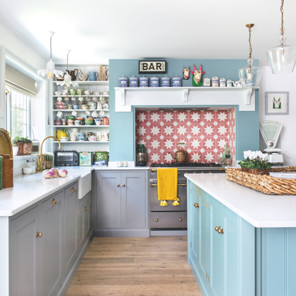 Bright and airy sky blue kitchen, with a red star tiled backsplash.