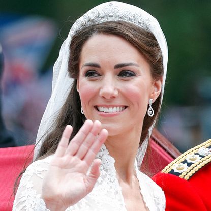 Kate Middleton rides in the carriage with Prince William on their wedding day in April 2011