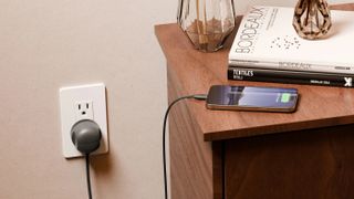 Twelve South Power Cord in slate black charging an iPhone