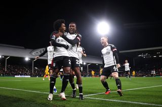 Willian of Fulham celebrates with team mate Alex Iwobi after scoring his sides third goal from the penalty spot during the Premier League match between Fulham FC and Wolverhampton Wanderers at Craven Cottage on November 27, 2023 in London, England. (Photo by Alex Pantling/Getty Images)