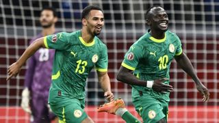 Iliman Ndiaye and Sadio Mane of Senegal celebrate a goal at the Africa Cup of Nations 2025.