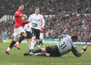 DERBY, ENGLAND - MARCH 15: Cristiano Ronaldo of Manchester United clashes with Roy Carroll of Derby County during the Barclays FA Premier League match between Derby County and Manchester United at Pride Park on March 15 2008, in Derby, England. (Photo by John Peters/Manchester United via Getty Images)