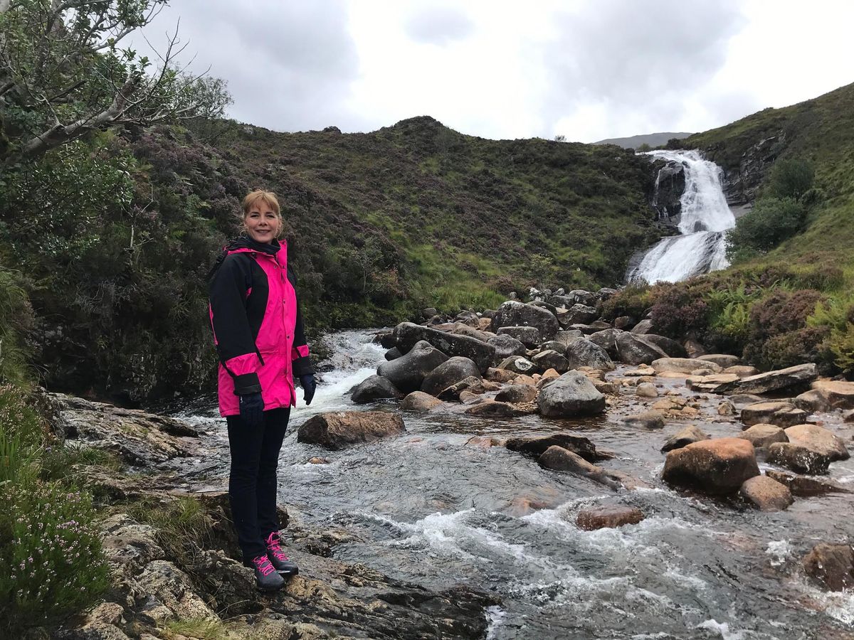 Darcey Bussell stands by a Scottish river