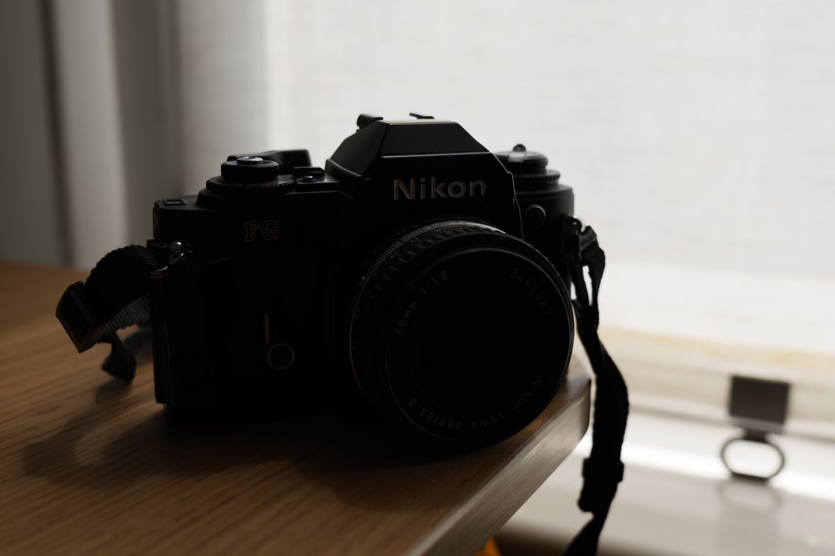 A backlit photo of a Nikon FG taken on the Panasonic Lumix S9