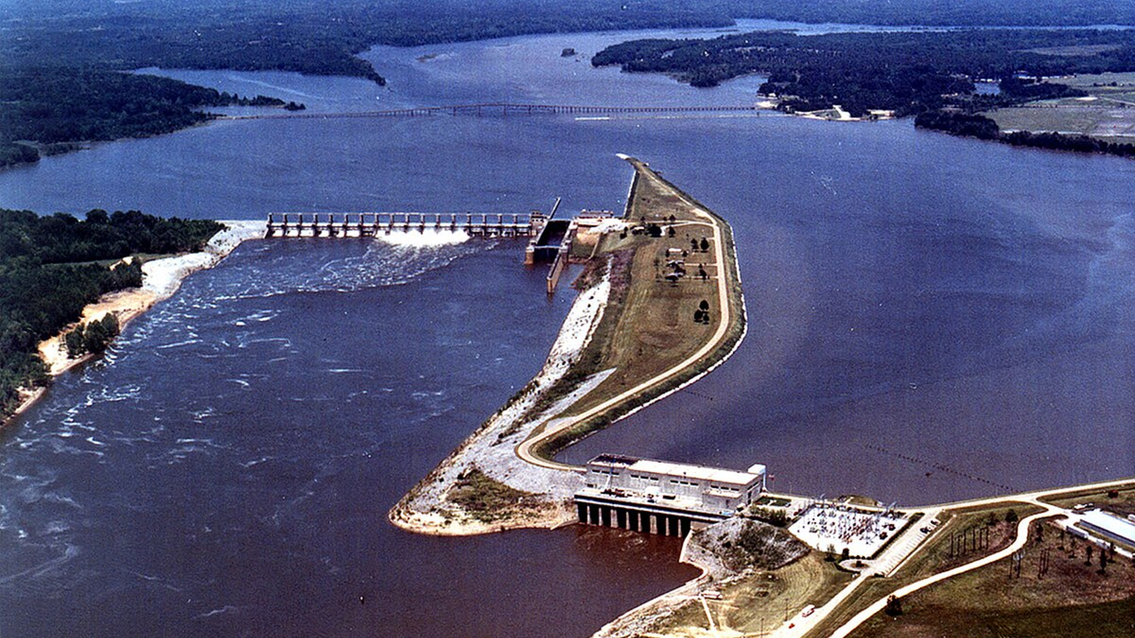 An aerial photo of a reservoir and dam on the Alabama River in the 1970s