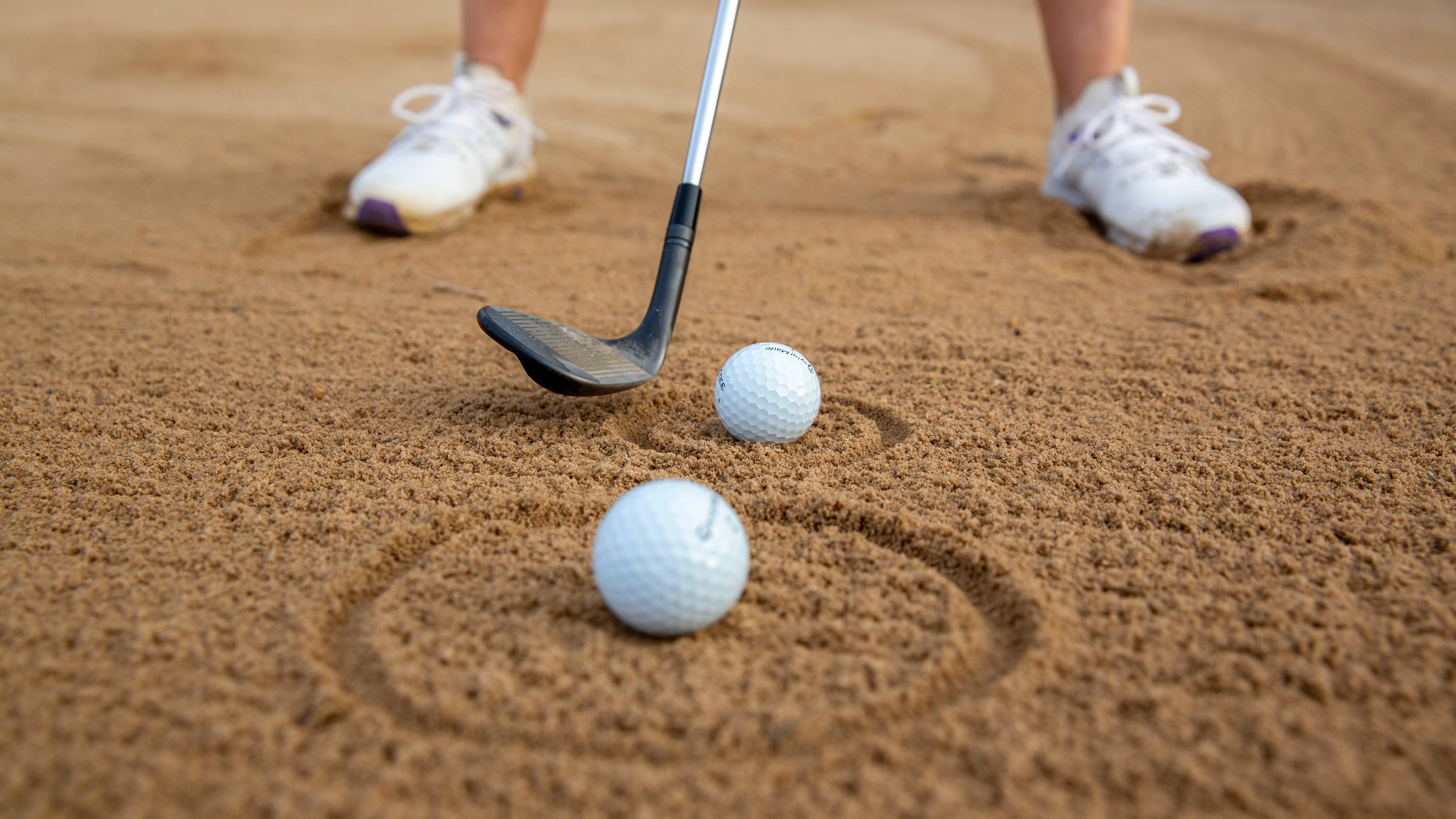 Circles round golf balls to hit sand before ball