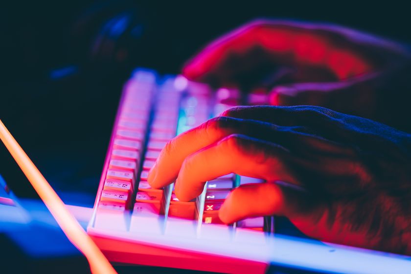 A pair of hands using a keyboard