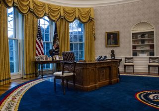  A view of the Resolute desk seen during an early preview of the redesigned Oval Office awaiting President Joseph Biden at the White House in Washington, D.C. on Jan. 2021. An Apollo 17 moon rock can be seen on the bottom shelf of the bookcase at far right.