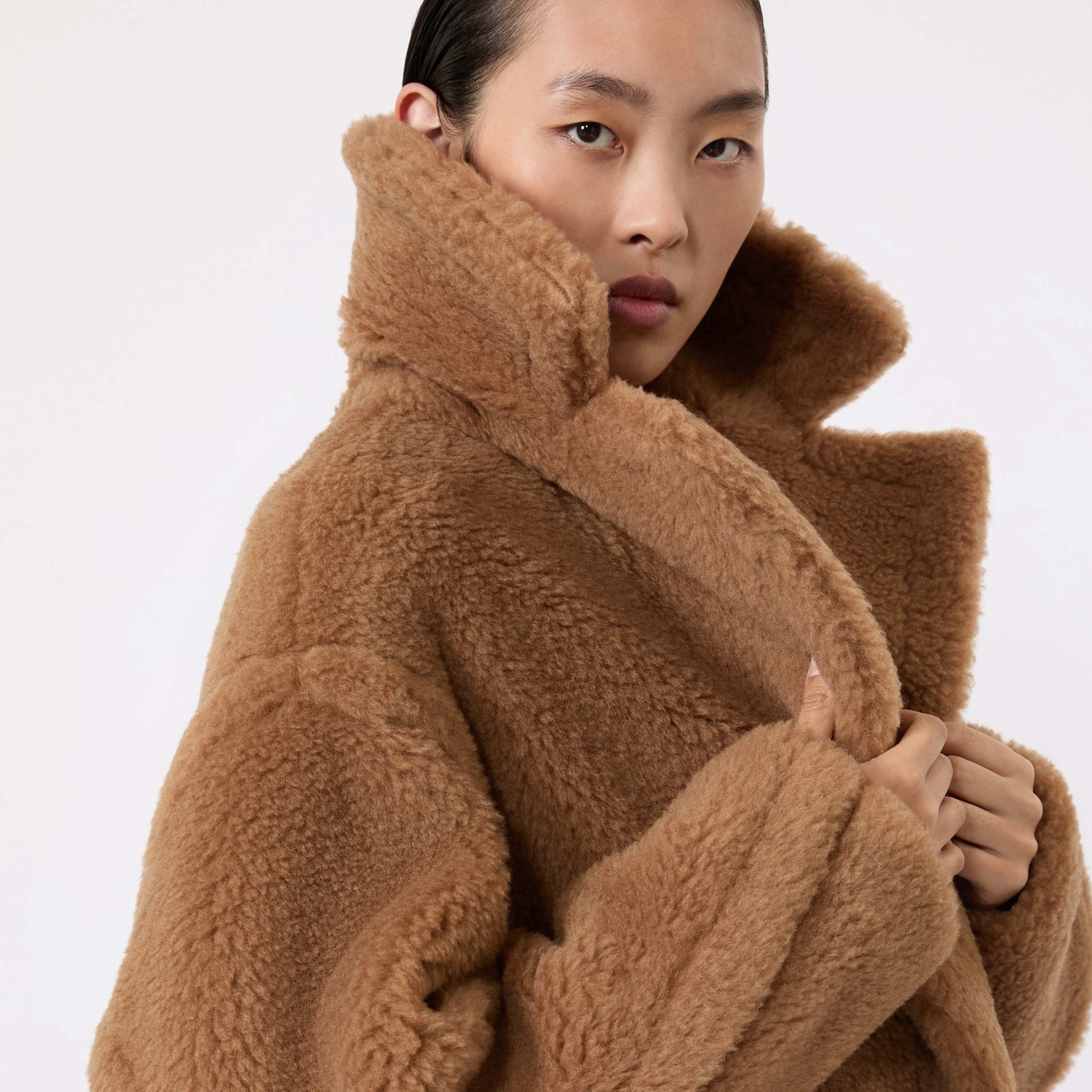 A model wears a Max Mara teddy coat.