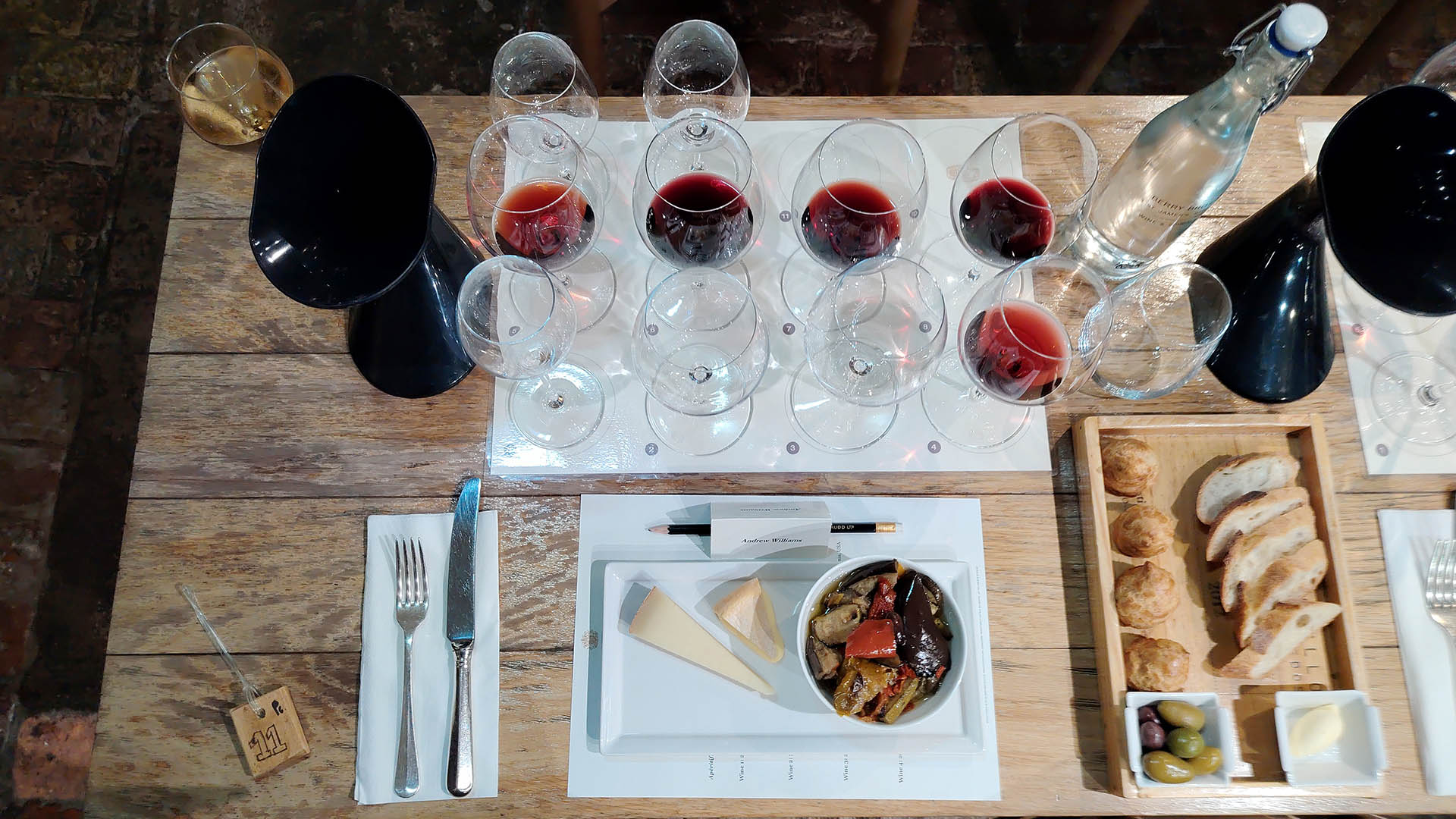 A photo of a wine tasting platter from above.