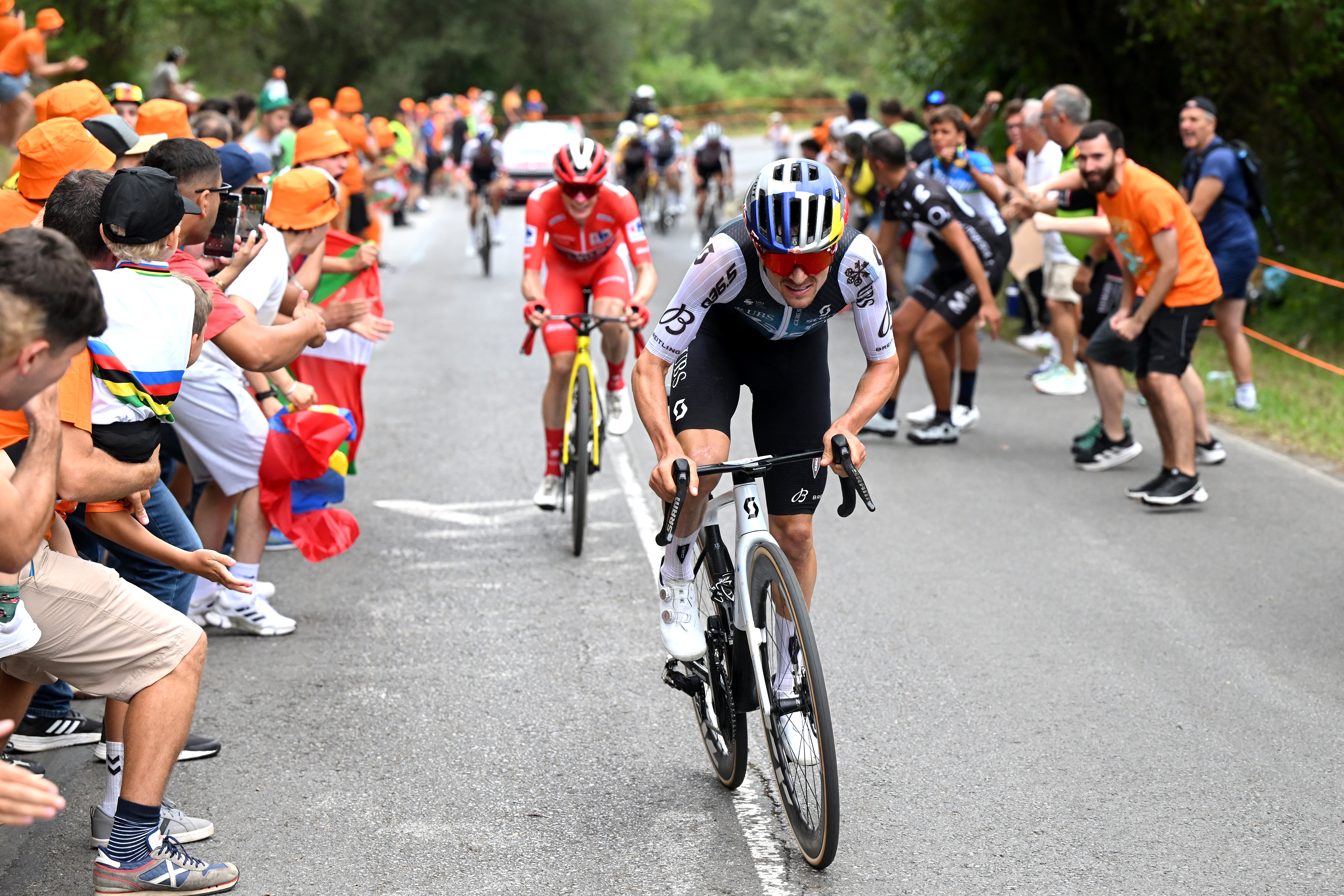 Tom Pidcock cycles with Jonas Vingegaard behind on stage 11 of the Vuelta a España