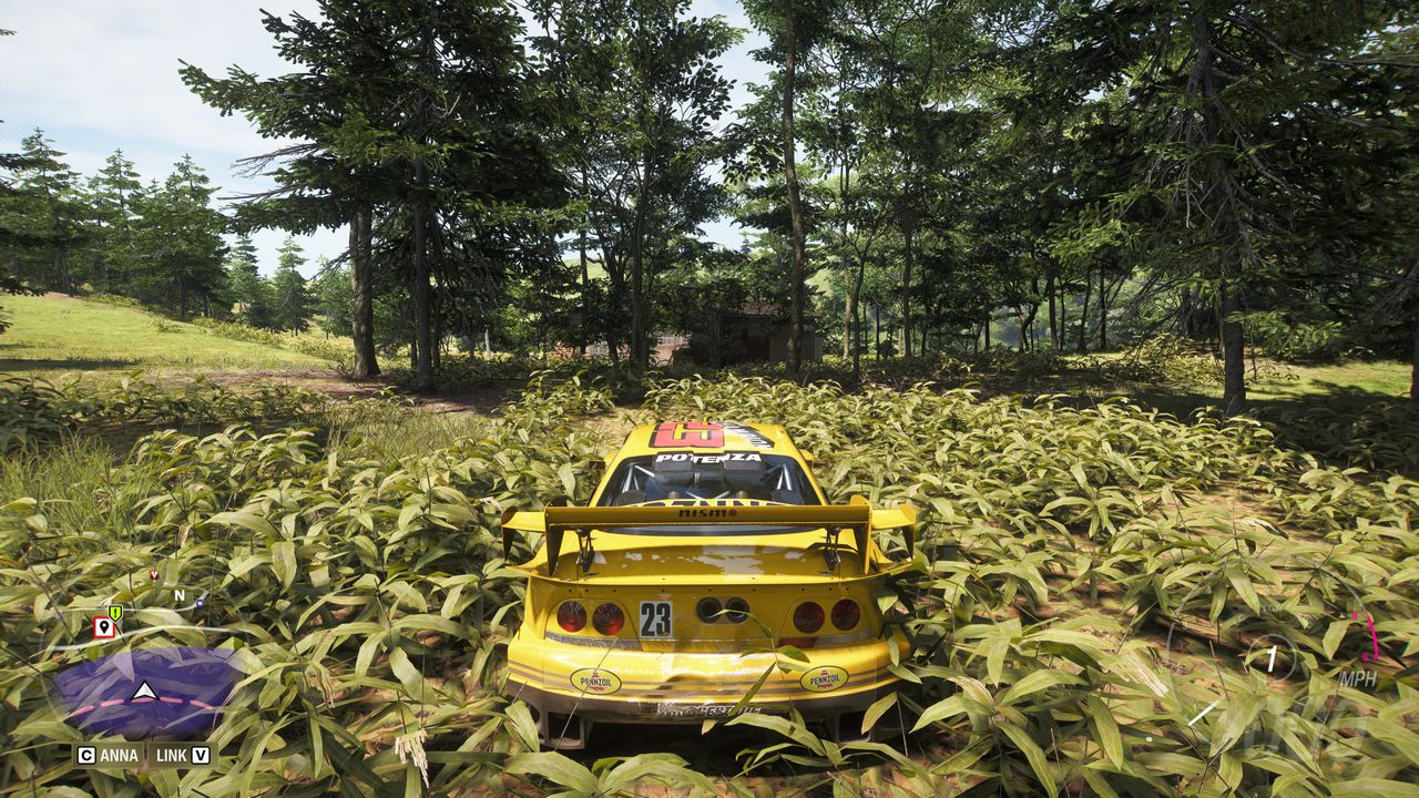 Forza Horizon 6 Barn Finds: A player parked in a grassy field, looking at a barn in the woods ahead.