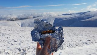 A cherry flapjack in the foreground, ahead of a stunning view of Helvellyn