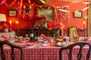 A joyous Christmas table with block printed linens and colourful paper streamers
