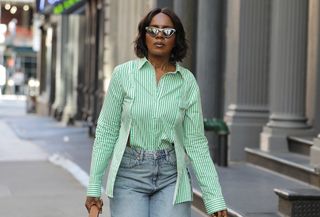 New Yorker wearing a green striped button-down.