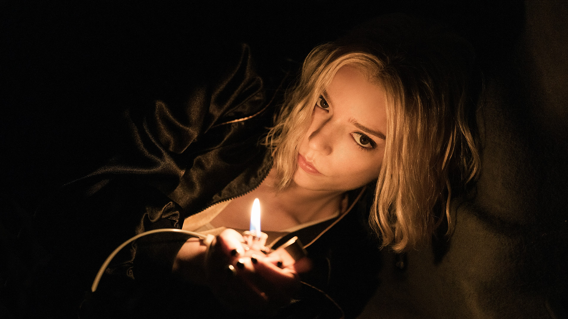 Anya Taylor-Joy holds a lighter in Apple TV's Lucky