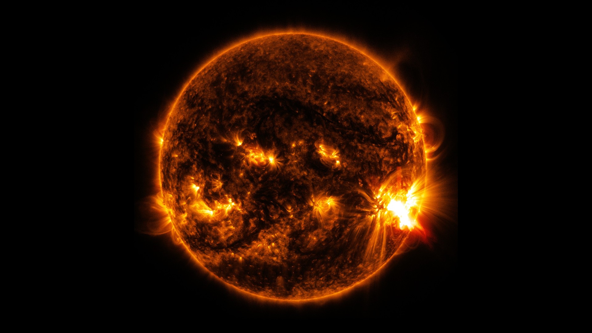 NASA's Solar Dynamics Observatory captured this image of an X2.0-class solar flare bursting off the lower right side of the sun on Oct. 27, 2014. The image shows a blend of extreme ultraviolet light with wavelengths of 131 and 171 Angstroms.
