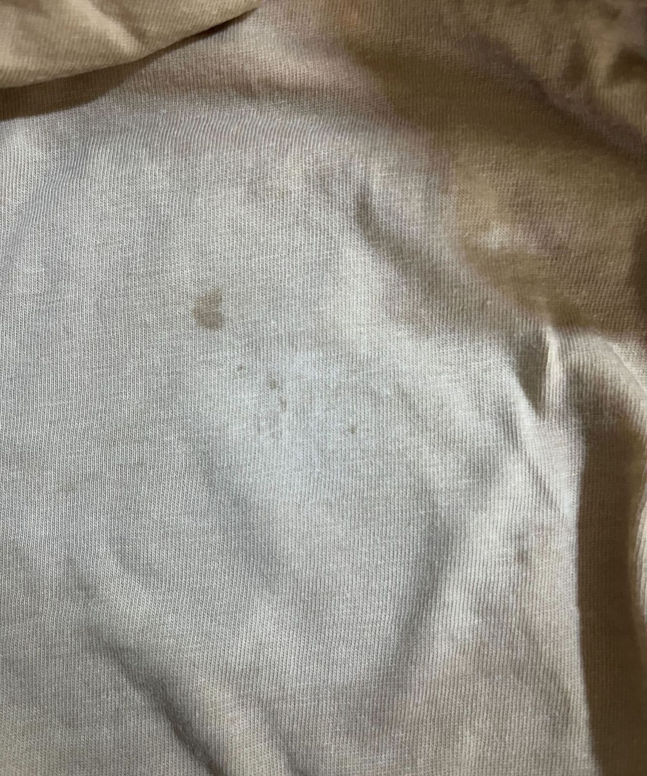 Fading blood stains on an beige top