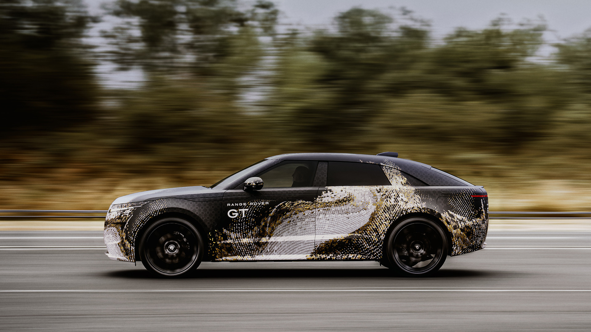 Camouflaged Range Rover GT on the road