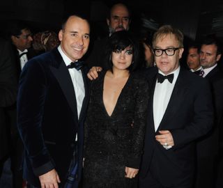 Lily Allen poses with Elton John and David Furnish in 2009.
