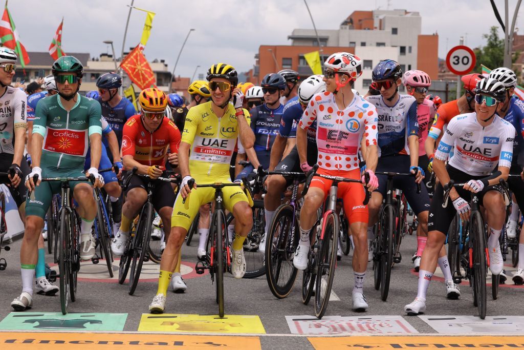 Cofidis French rider Victor Lafay L wearing the best sprinters green jersey UAE Team Emirates British rider Adam Yates C wearing the overall leaders yellow jersey EF Education Easyposts US rider Neilson Powless 2nd R wearing the best climbers polka dot dotted jersey and UAE Team Emirates Slovenian rider Tadej Pogacar R wearing the best young riders white jersey await the start of the 3rd stage of the 110th edition of the Tour de France cycling race 1935 km between AmorebietaEtxano in Northern Spain and Bayonne in southwestern France on July 3 2023 Photo by Thomas SAMSON AFP Photo by THOMAS SAMSONAFP via Getty Images