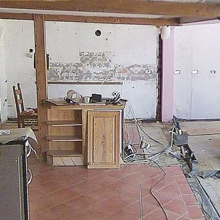 white wall brown floor before kitchen renovation