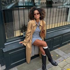 Amaka wearing trench