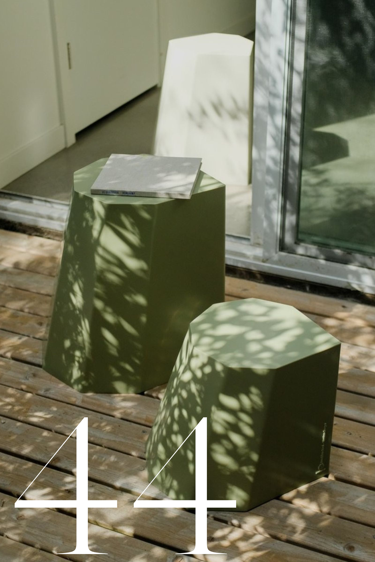 green stools on deck in dappled sunlight
