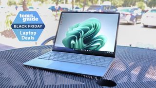 Surface Laptop Go 3 outside with a Tom's Guide Black Friday deals badge