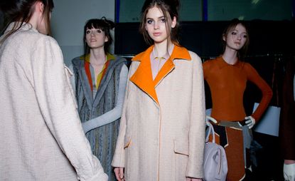 Female models dressed in the Missoni A/W 2014 backstage of the fashion show