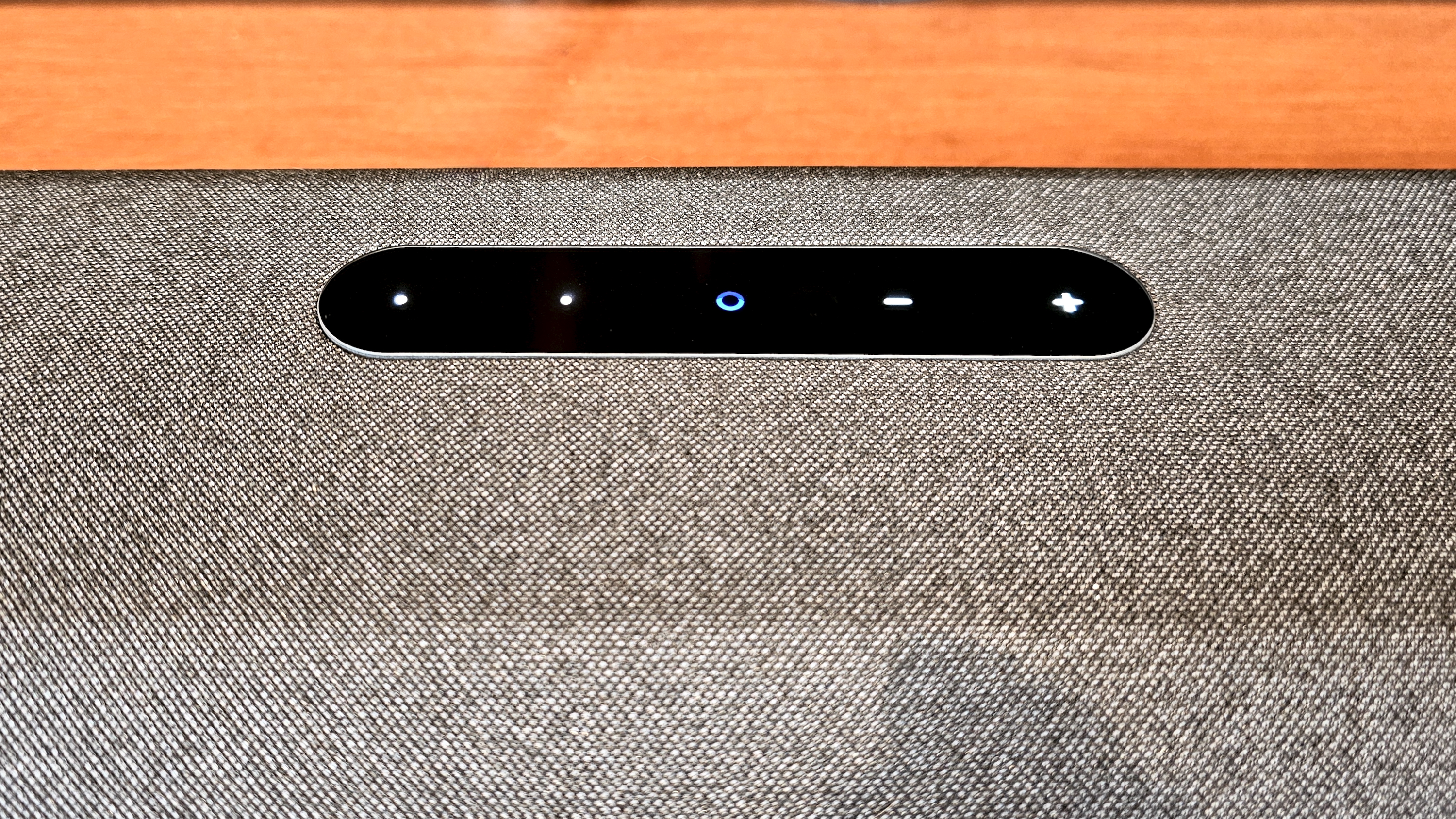 A close up of the touch controls on the Bluesound Pulse Mini soundbar