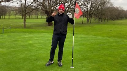 Player Jonny Gaffney at the green after hitting his hole-in-one