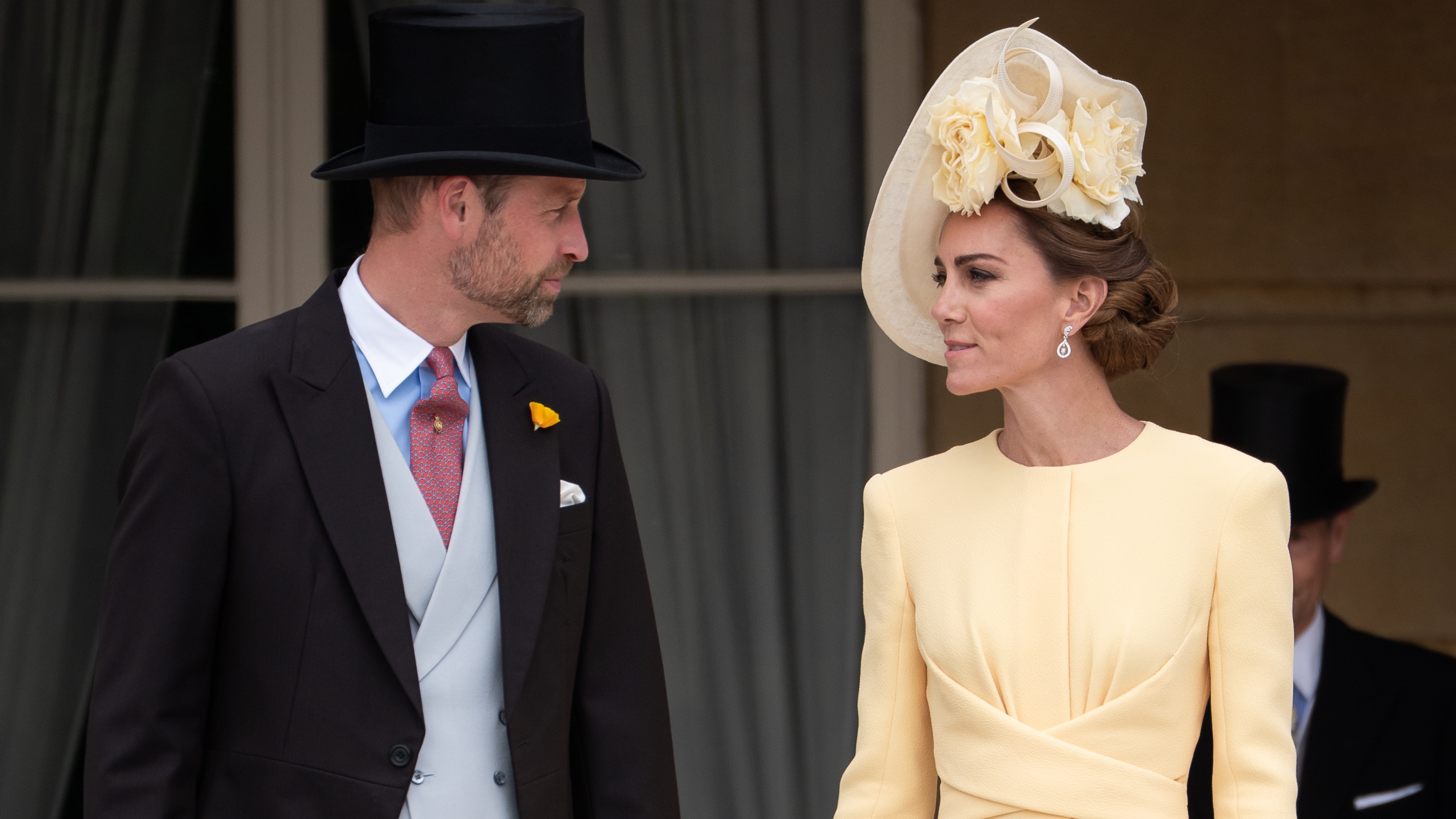 Prince William and Catherine, Princess of Wales stand at the top of the Garden steps, as the National Anthem is played, before the start of a Royal Garden Party at Buckingham Palace on May 20, 2025