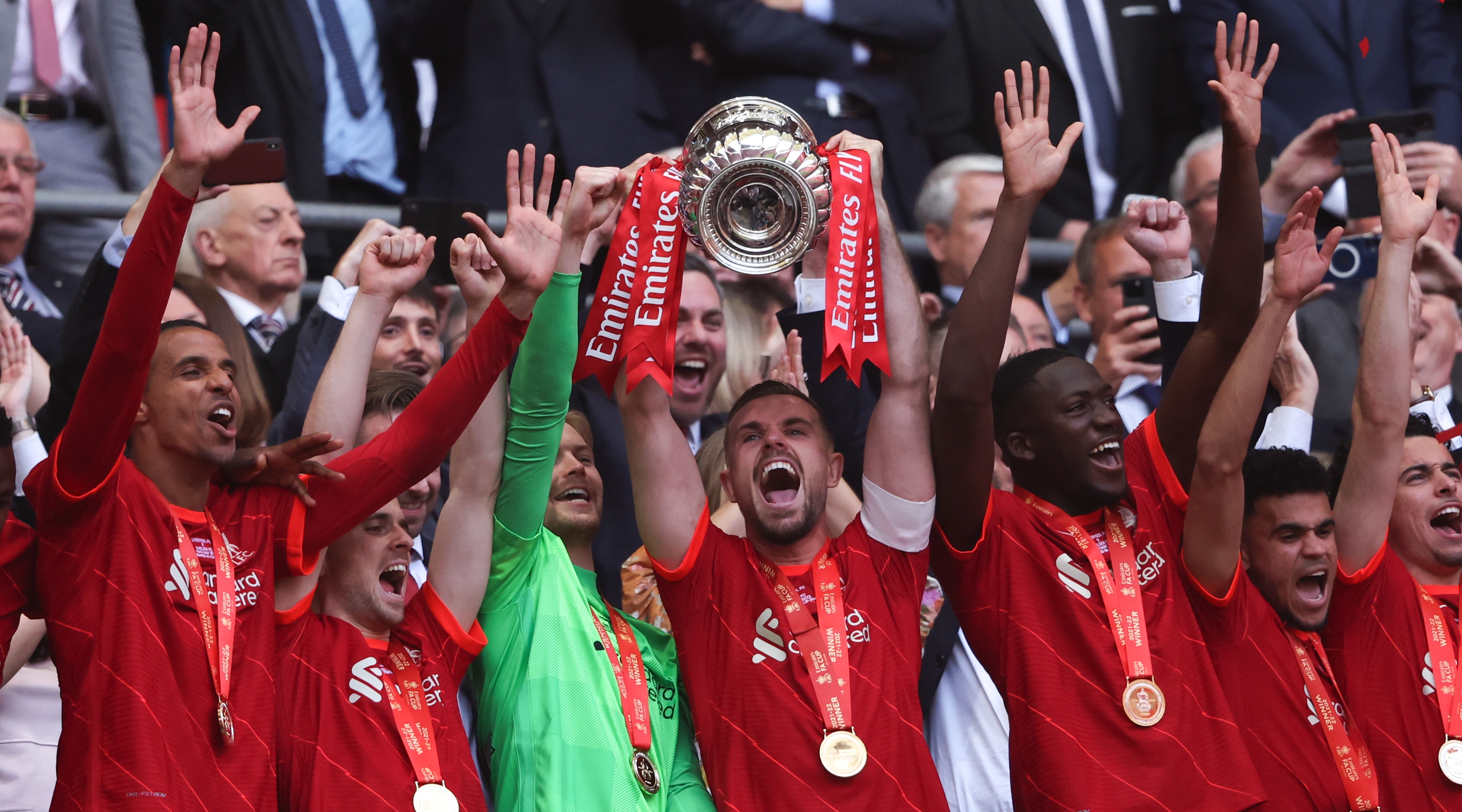 Liverpool captain Jordan Henderson lifts the FA Cup trophy after Liverpool beat Chelsea in the 2022 FA Cup final on 14 May, 2022 at Wembley Stadium in London, United Kingdom.