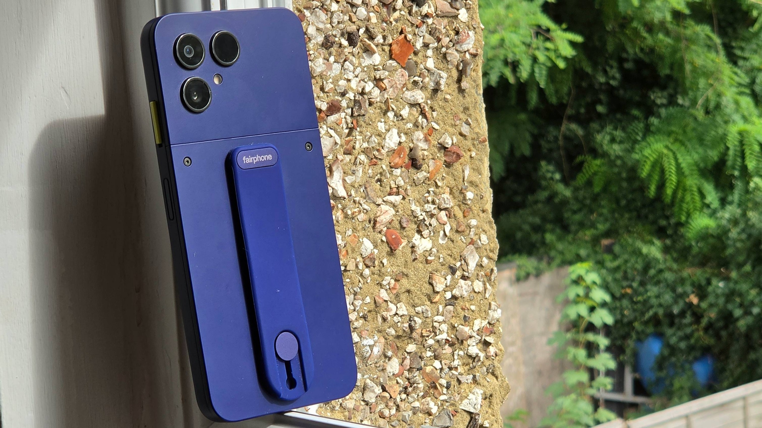 The Fairphone 6 Plus on a window sill.