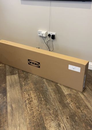 Brown IKEA box lying on the floor