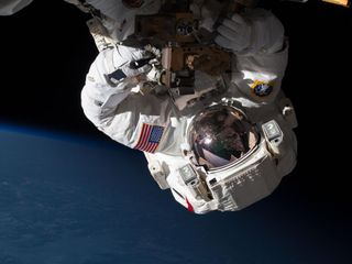 Astronaut Chris Cassidy repairs the international space station.