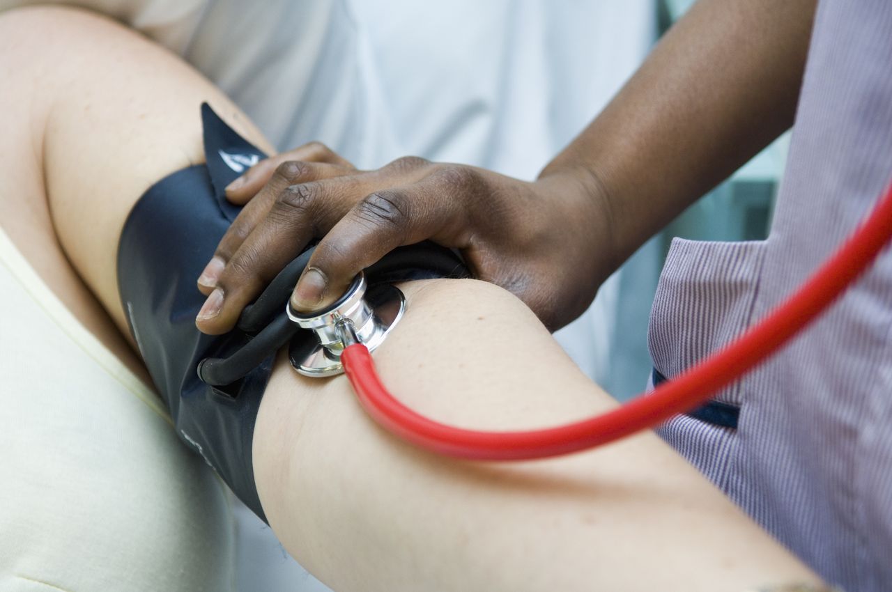 nurse checking pulse in hospital