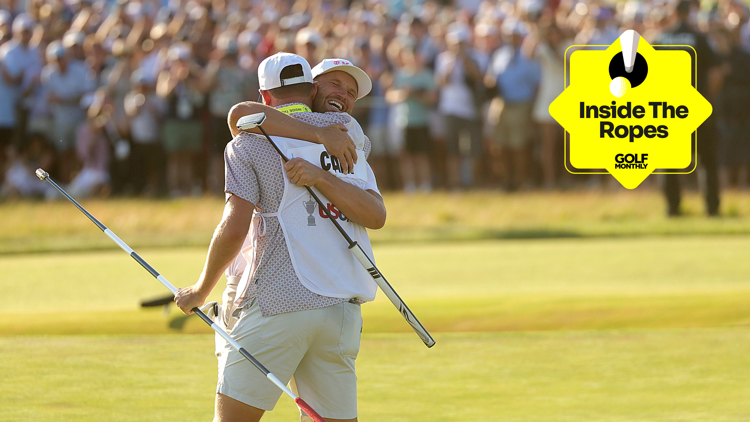 Wyndham Clark and his caddie embrace on the 18th green at Shinnecock Hills after winning the 2026 US Open, with a yellow Golf Monthly Inside The Ropes logo top-right
